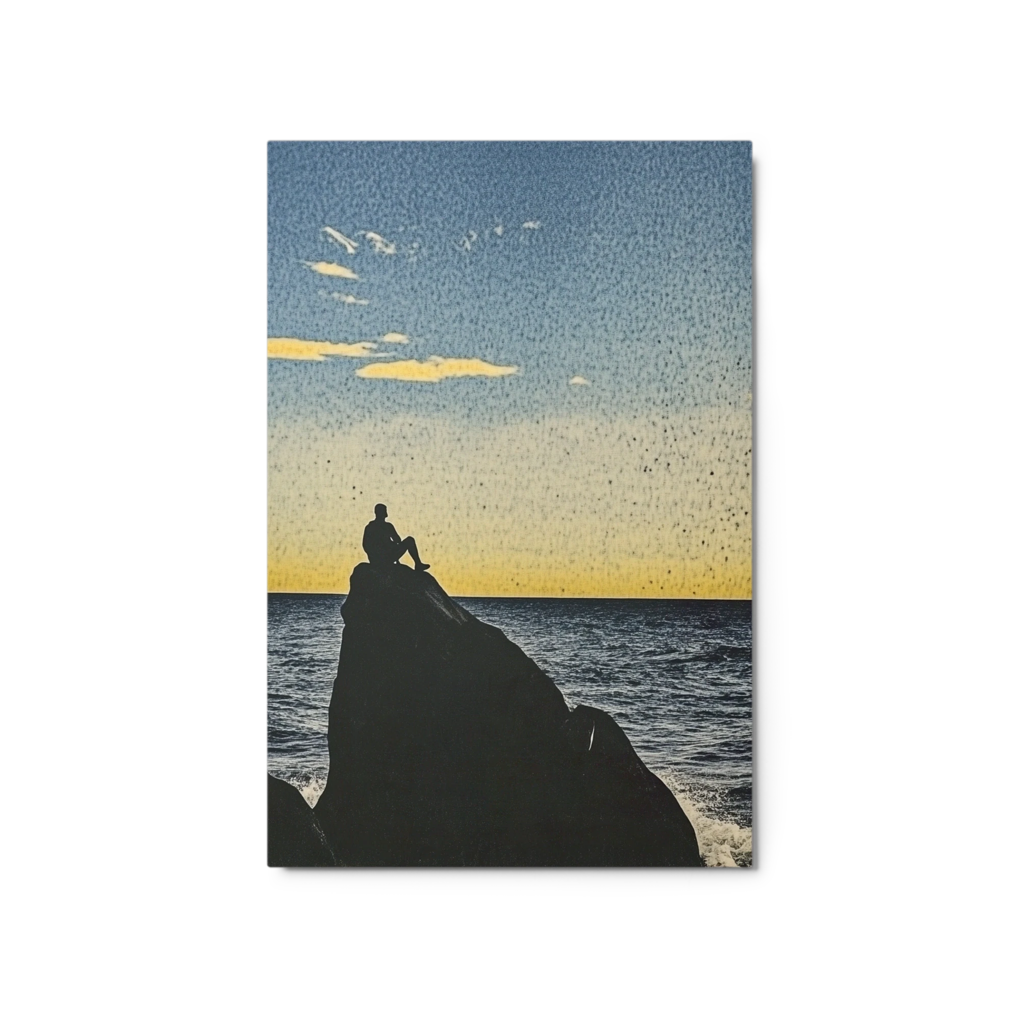 Silhouette of a Person on a Rock at Sunset
